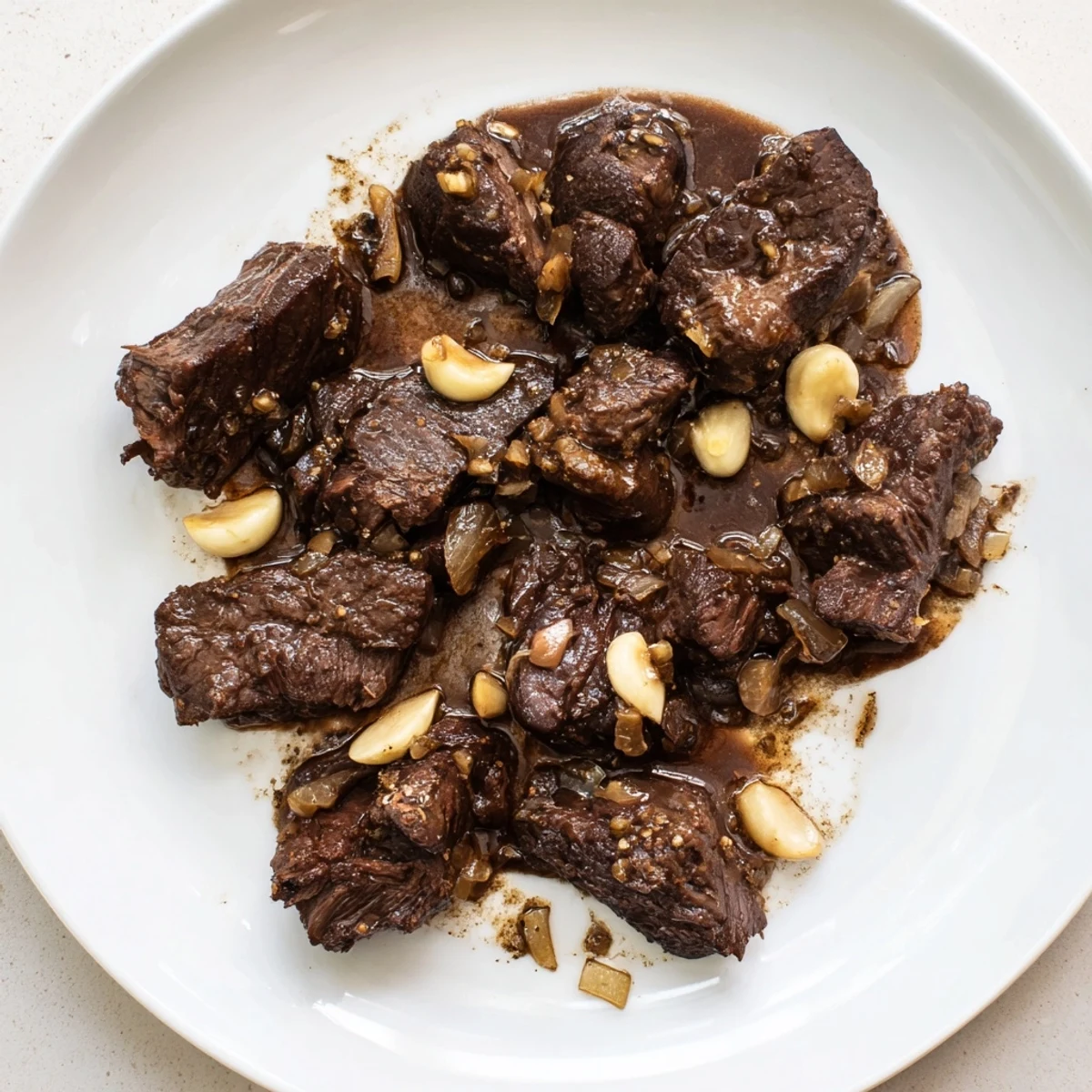 Tender Crock Pot shredded beef piled high with two forks for serving