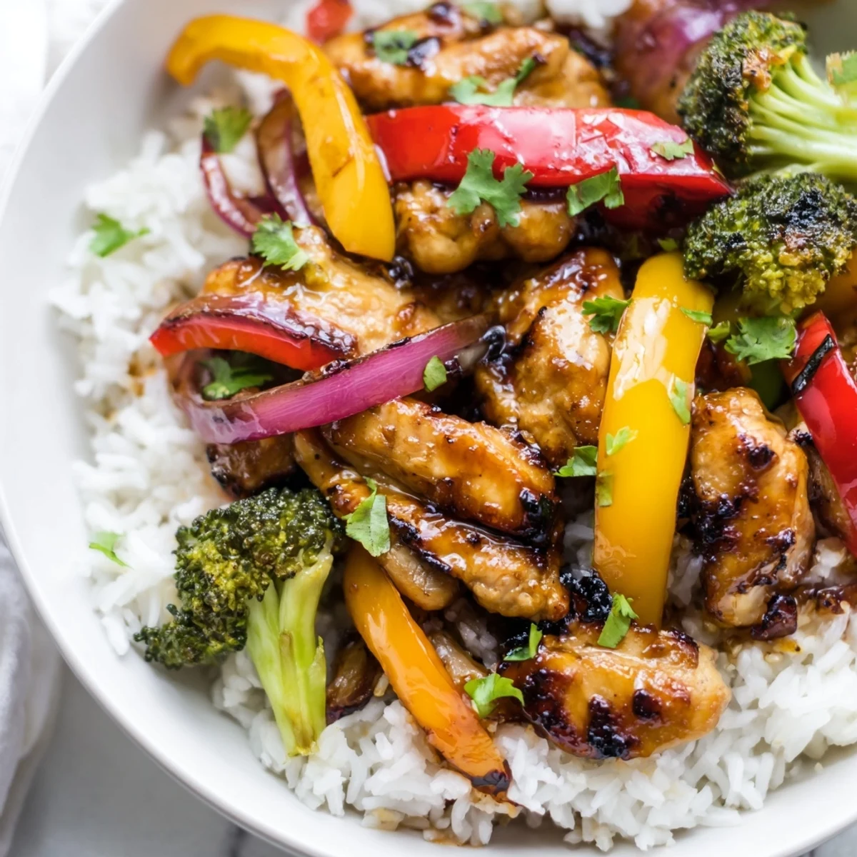 Quick flavorful weeknight meal served over fluffy steamed rice with fresh cilantro garnish on top