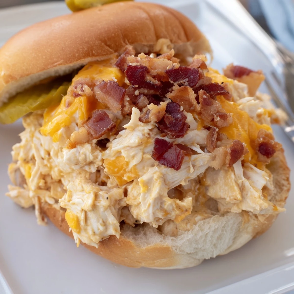 Hearty family style Crack Chicken Sandwiches on brioche, garnished with lettuce.