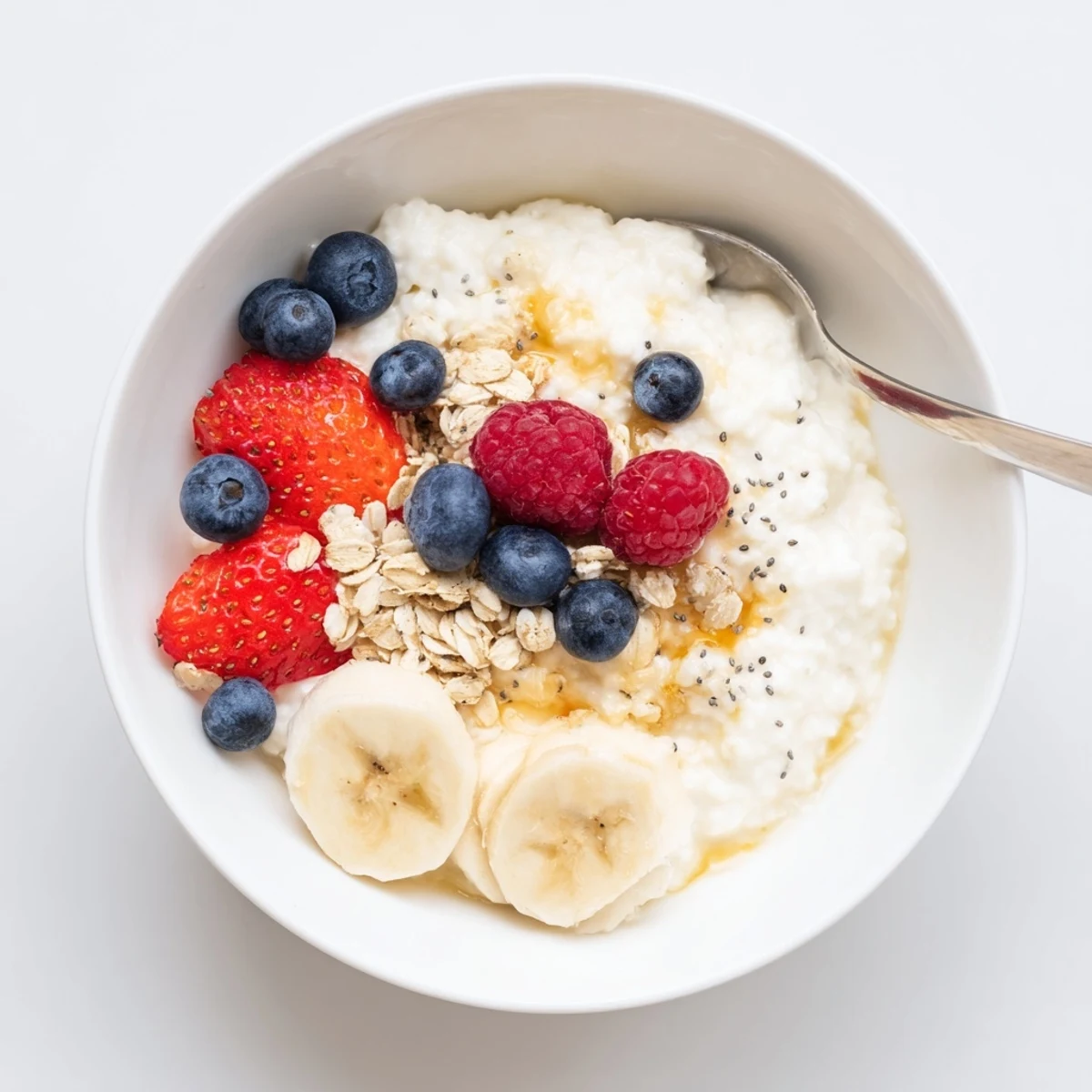 Bright Cottage Cheese Breakfast Bowl on wooden board with spoon, fresh berries