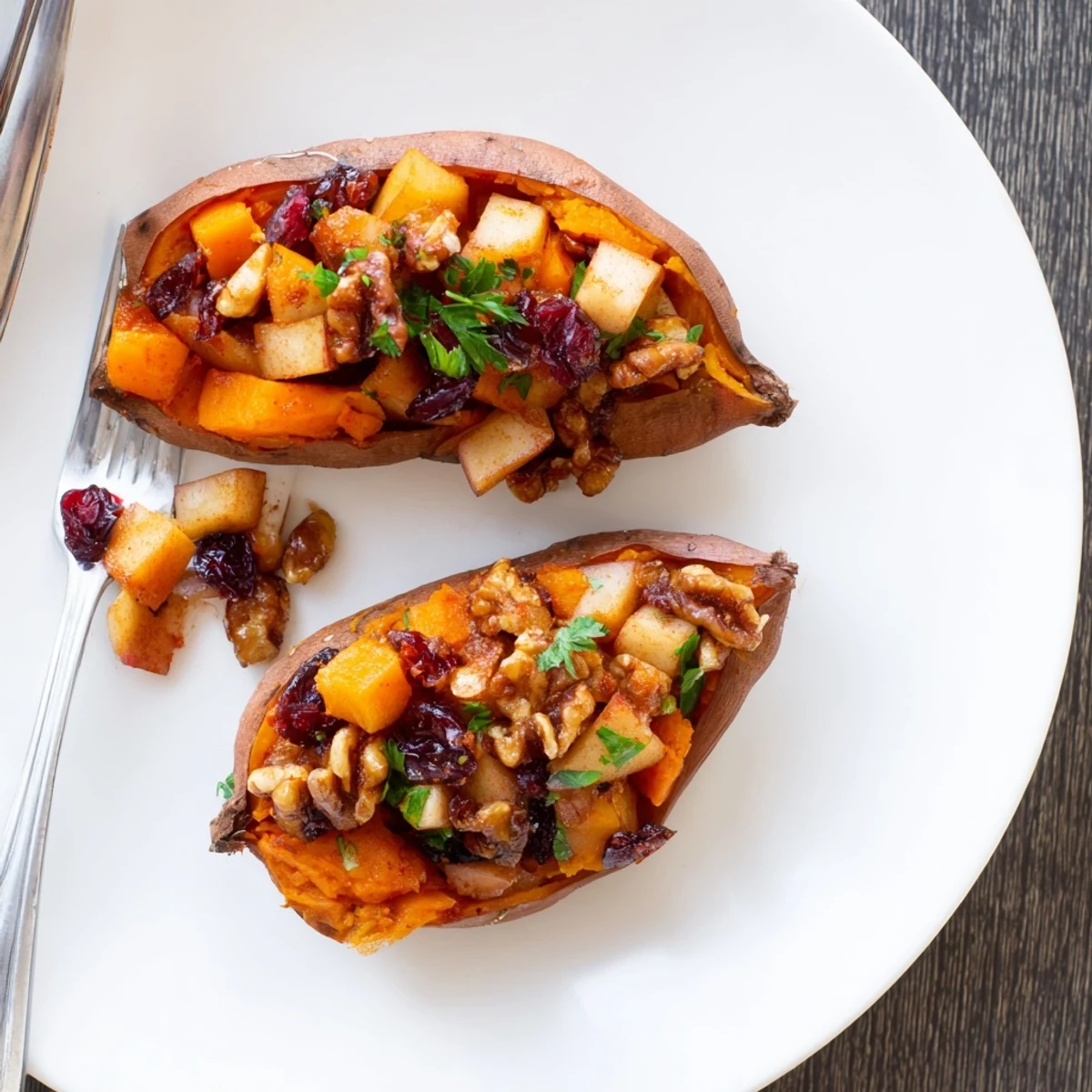 Stuffed Sweet Potatoes With Apples served warm, sprinkled with cranberries and chopped parsley