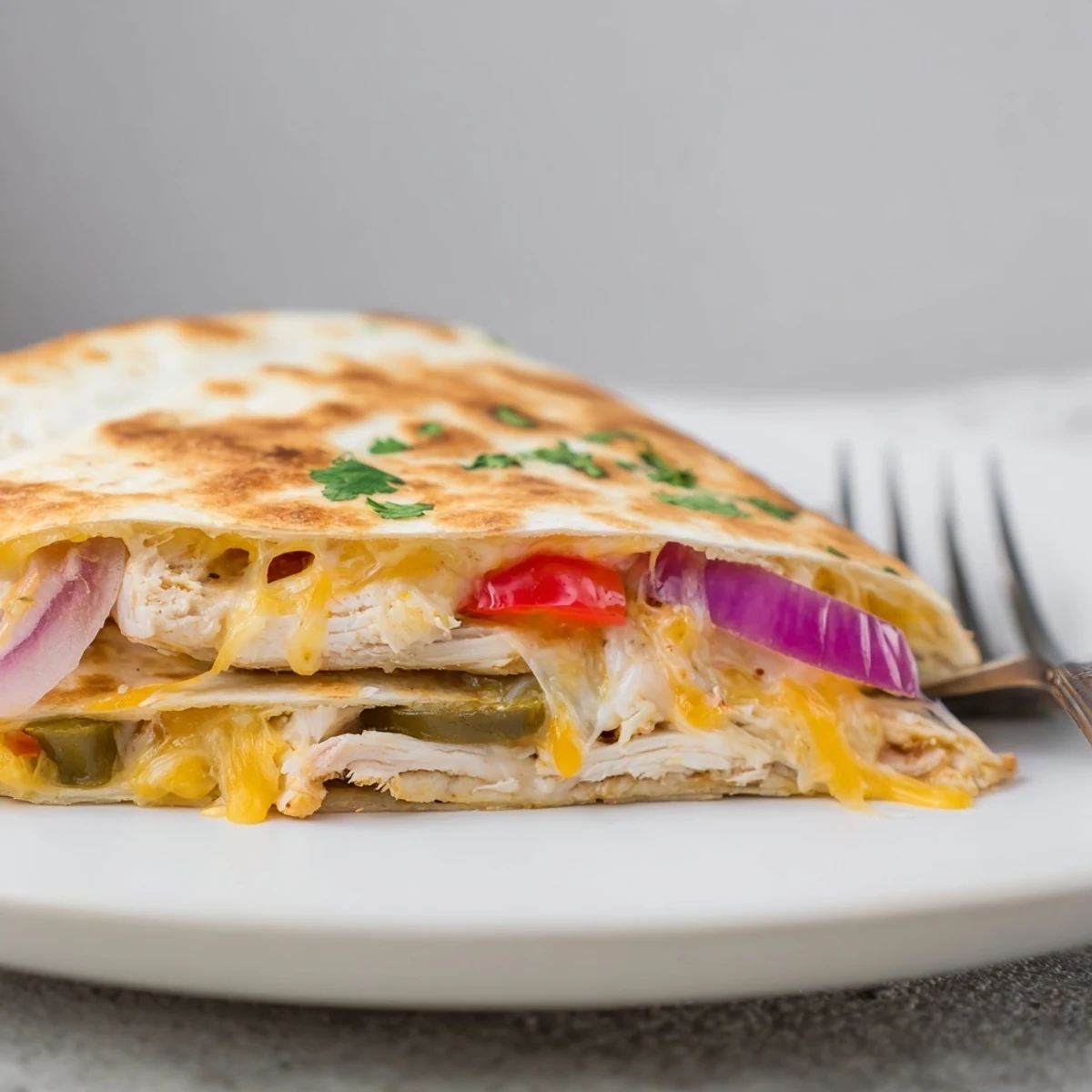 Spicy Crispy Grilled Chicken Quesadilla with golden crust, melted cheese oozing
