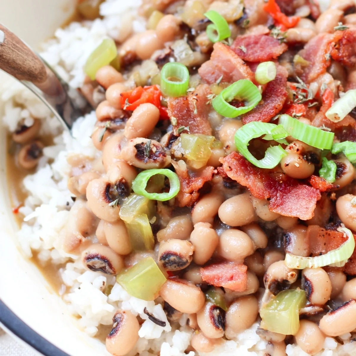 A spoonful of Hearty Smoky Southern Hoppin John over fluffy rice  
