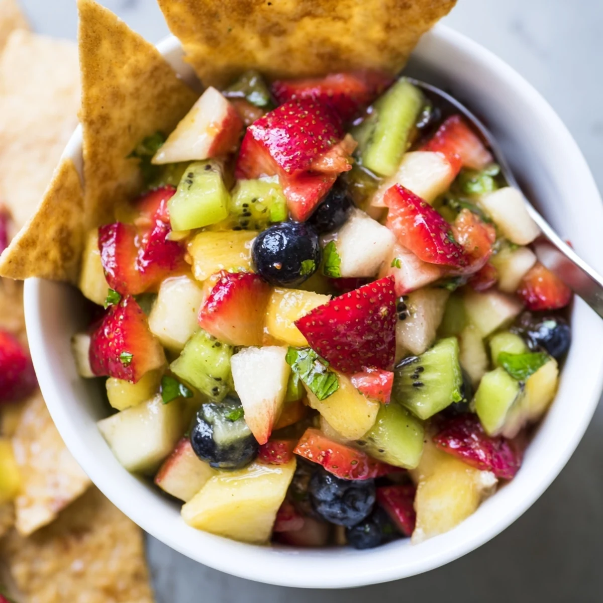 Bright chilled Fruit Salsa With Cinnamon Sugar Tortilla Chips, juicy and colorful