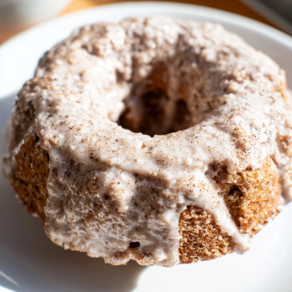 Baked banana bread donuts with classic spiced flavor and sweet vanilla glaze drizzle