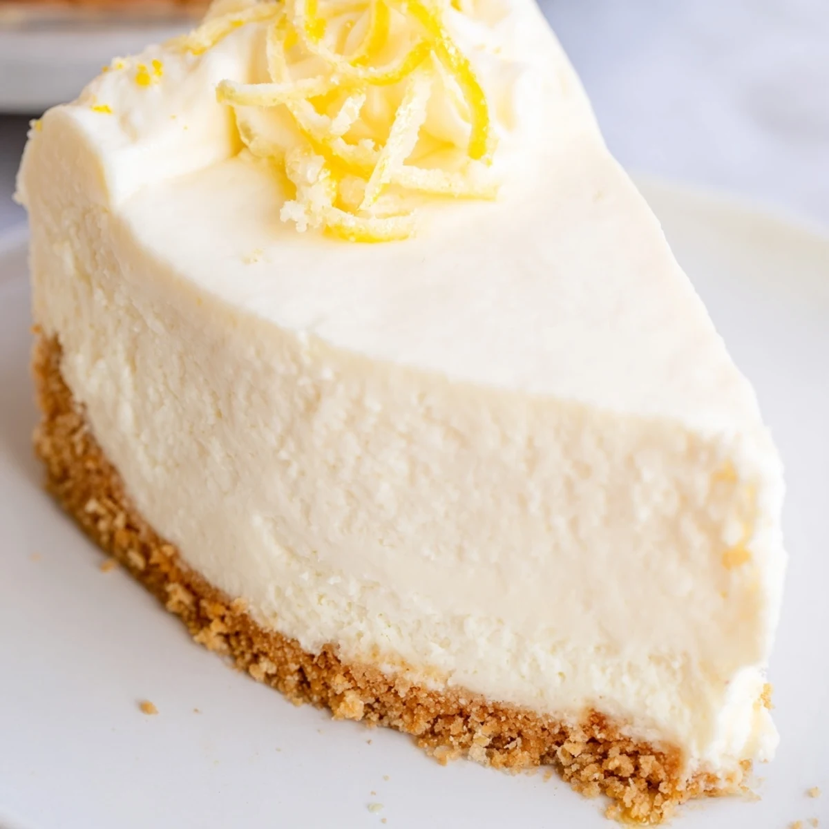 Classic Cheesecake with golden graham crust, creamy center and berry garnish.