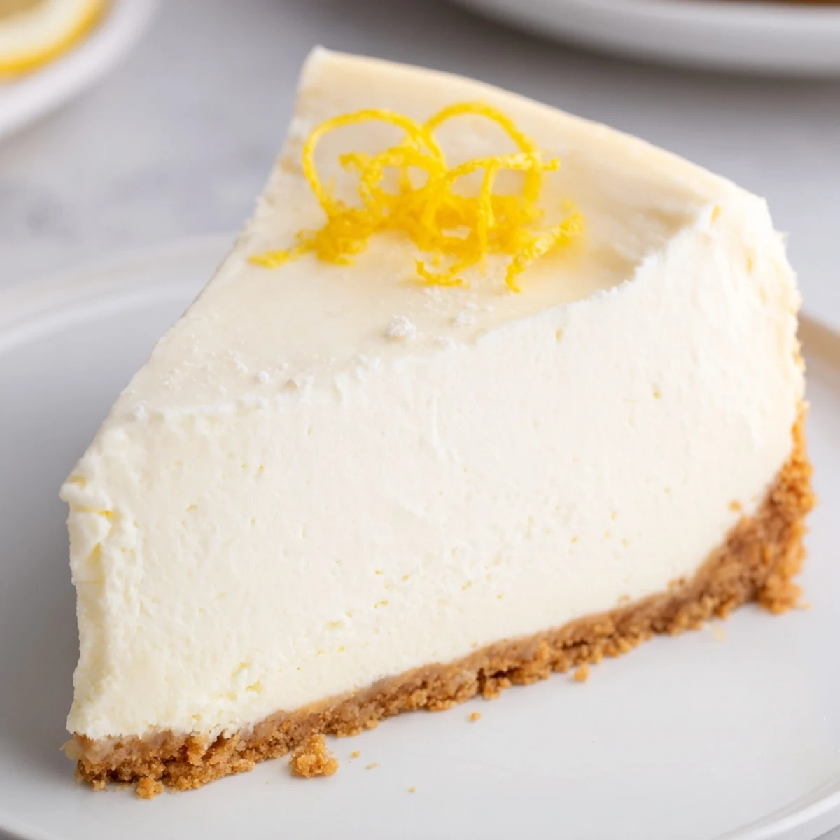 Sliced Classic Cheesecake cooling on rack, dense, silky filling, lemon hint.