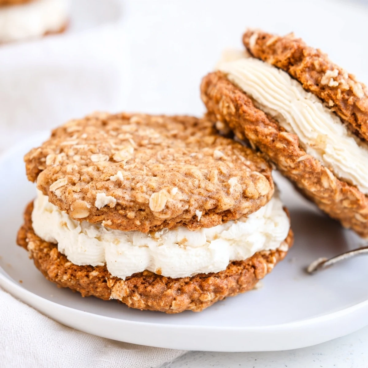 Gluten Free Oatmeal Creme Pies stacked, soft chewy cookies with vanilla filling.