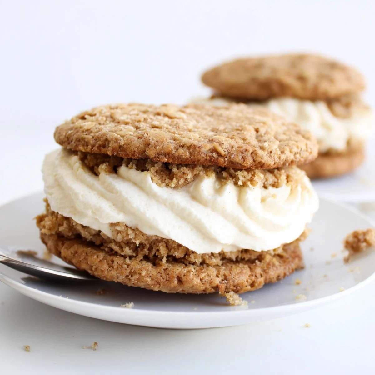 Warm Gluten Free Oatmeal Creme Pies cooling on rack, cinnamon scent rising.